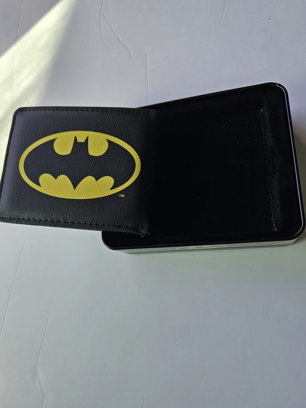 officially licensed DC Comics Batman Bifold Wallet resting inside its protective